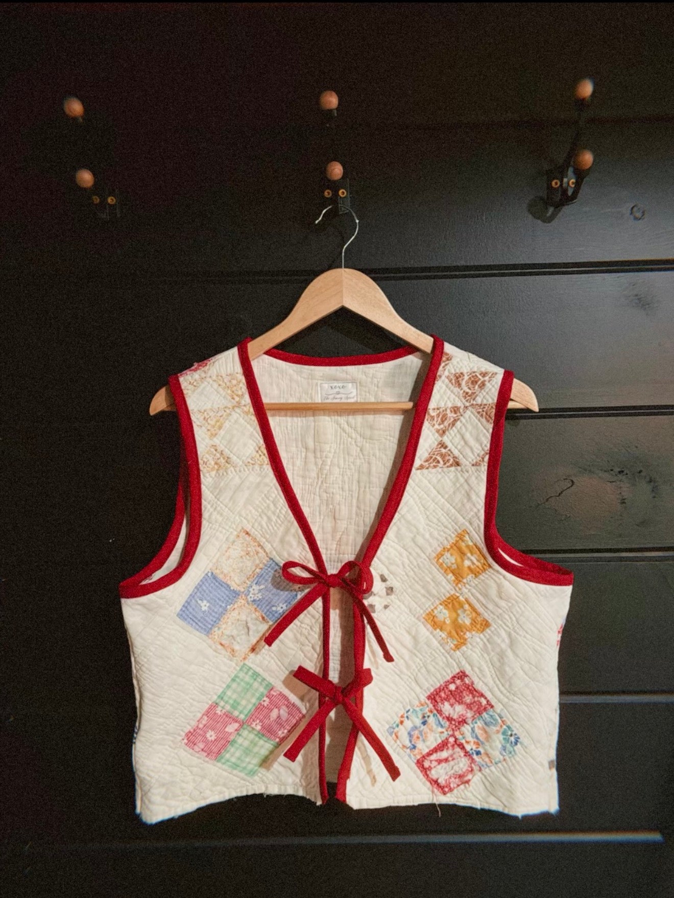 Vintage Quilt Patchwork Vest — Prototype (Perfectly Imperfect)

This handmade vest is crafted from an authentic vintage quilt, giving it a cozy, nostalgic feel with tons of cottage-core charm. Each patch of fabric carries its own story, making this piece truly one of a kind.

This vest is my very first prototype in this style, so it does come with a few imperfections — small irregularities in the stitching, shaping, or finish. These flaws don’t affect wear, but they do add to its handmade character. Because